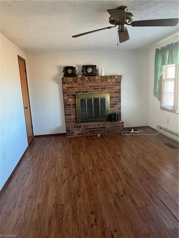 2052 Oregon Hill Road Ruffin, NC 27326 - Photo 7 of 24 family room with fireplace