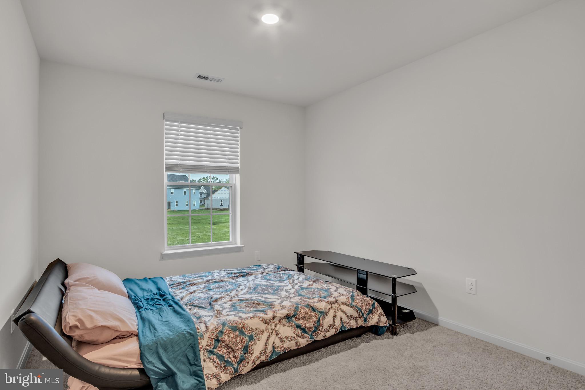 18 Smokehouse Road Carlisle, PA 17013 - Photo 24 of 33 a bedroom with a bed and a window