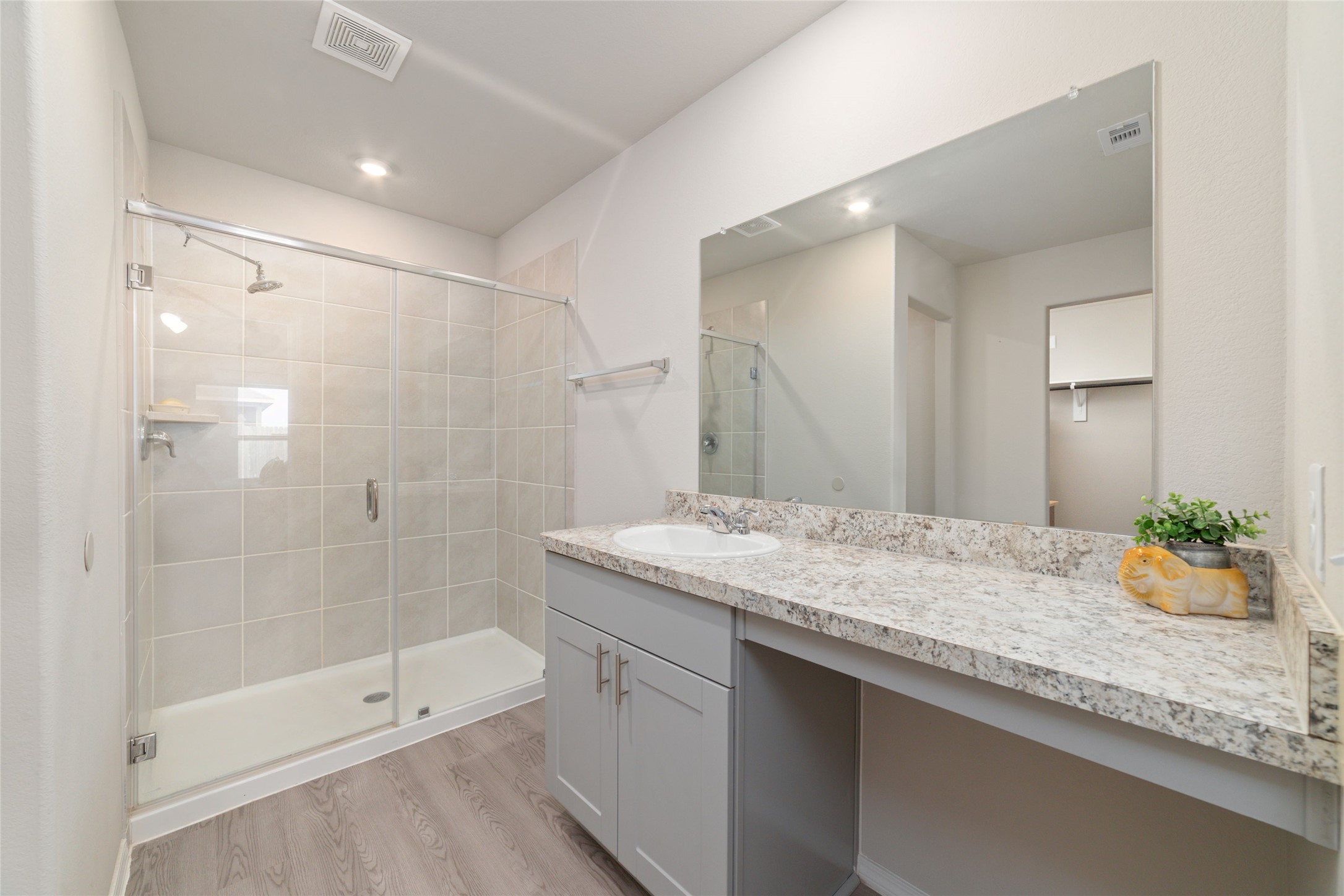 14232 Shasta Ridge Drive Conroe, TX 77303 - Photo 15 of 26 Well-appointed bathroom with a spacious vanity and glass-enclosed shower, creating a light and open atmosphere.