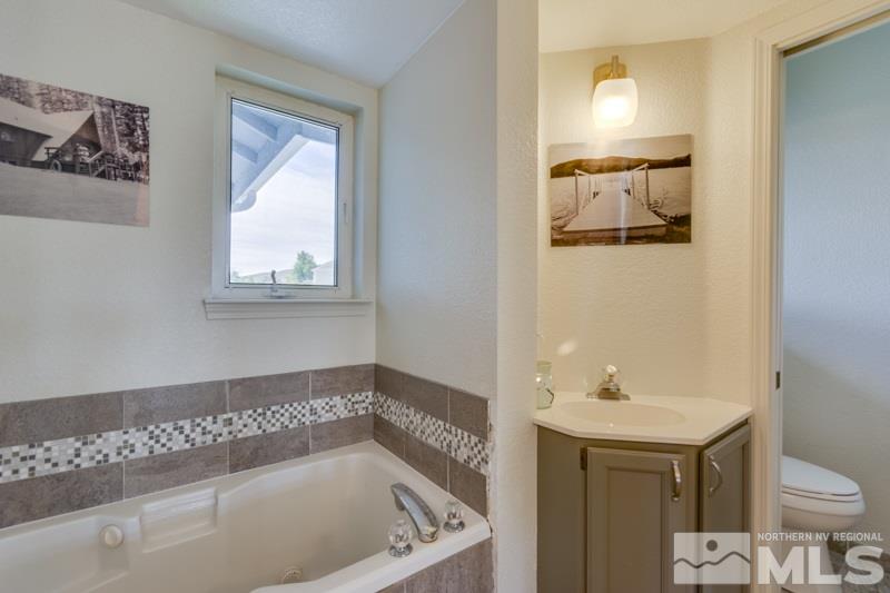 2245 Wide Horizon Drive Reno, NV 89509 - Photo 19 of 25 a bathroom with a bathtub and a sink