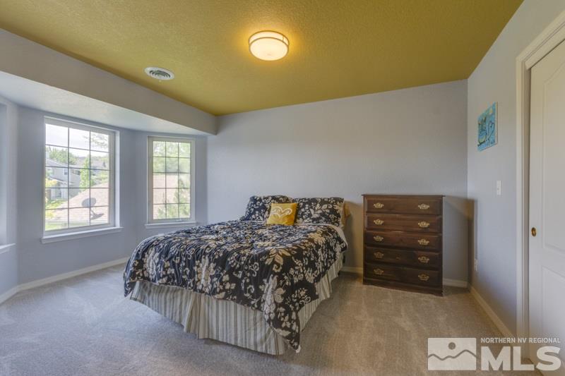 2245 Wide Horizon Drive Reno, NV 89509 - Photo 20 of 25 a bedroom with a bed and a window