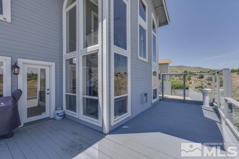 2245 Wide Horizon Drive Reno, NV 89509 - Photo 22 of 25 a view of a balcony with wooden floor and iron stairs