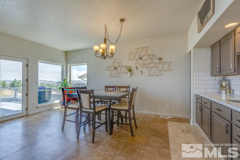 2245 Wide Horizon Drive Reno, NV 89509 - Photo 5 of 25 a view of a dining room with furniture and wooden floor
