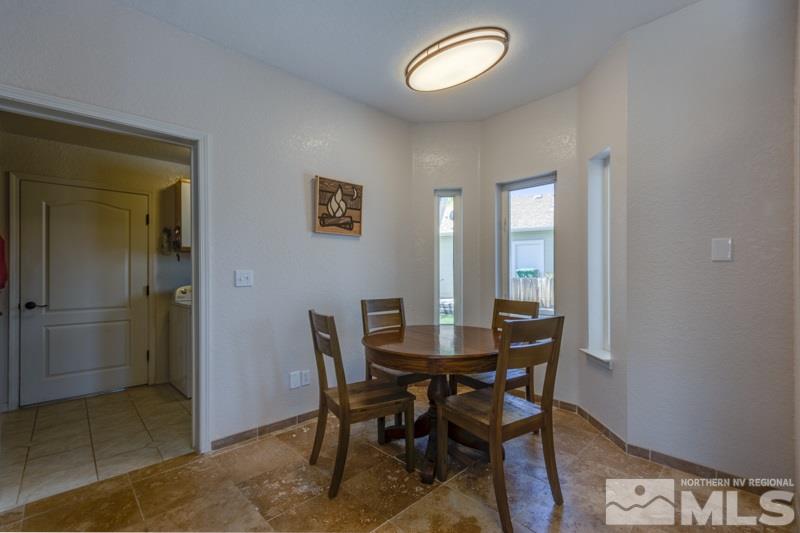 2245 Wide Horizon Drive Reno, NV 89509 - Photo 9 of 25 a view of a dining room with furniture and window