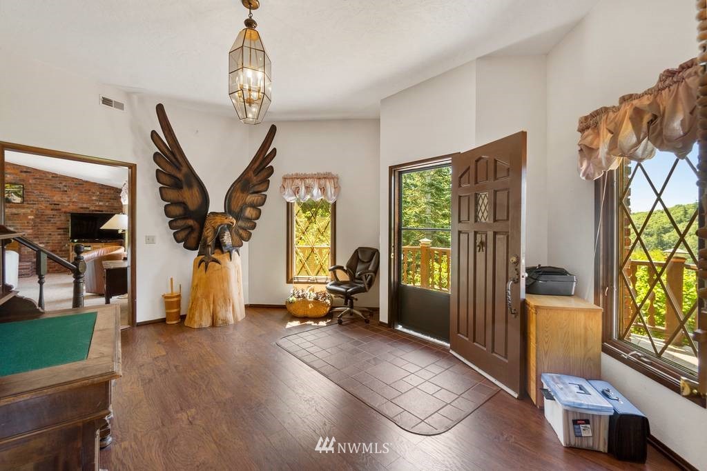 1624 King Road Winlock, WA 98596 - Photo 15 of 39 a living room with furniture windows and a chandelier
