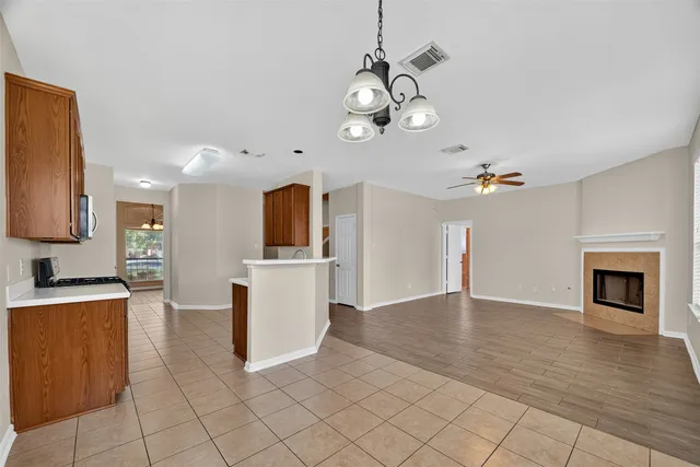 a view of a kitchen with a sink and a stove top oven