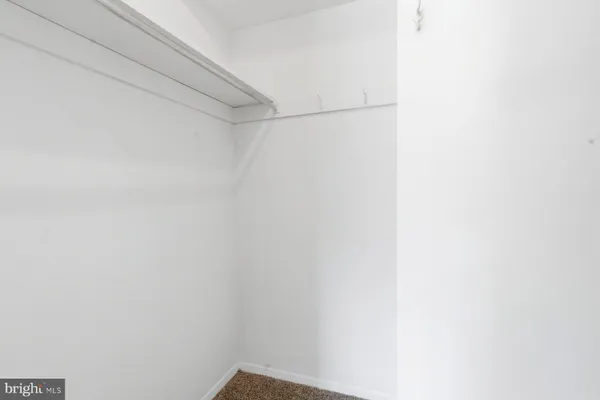 a bathroom with a sink and toilet with mirror