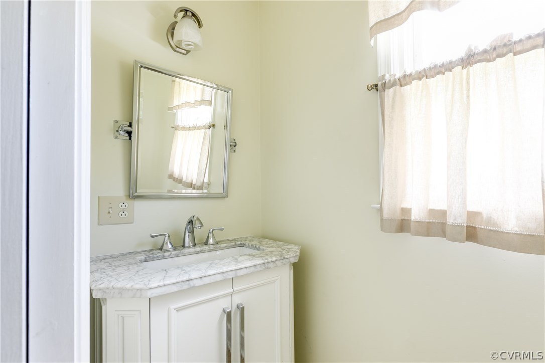 9641 Pasture Hill Road Midlothian, VA 23112 - Photo 14 of 30 a bathroom with a granite countertop sink and a mirror