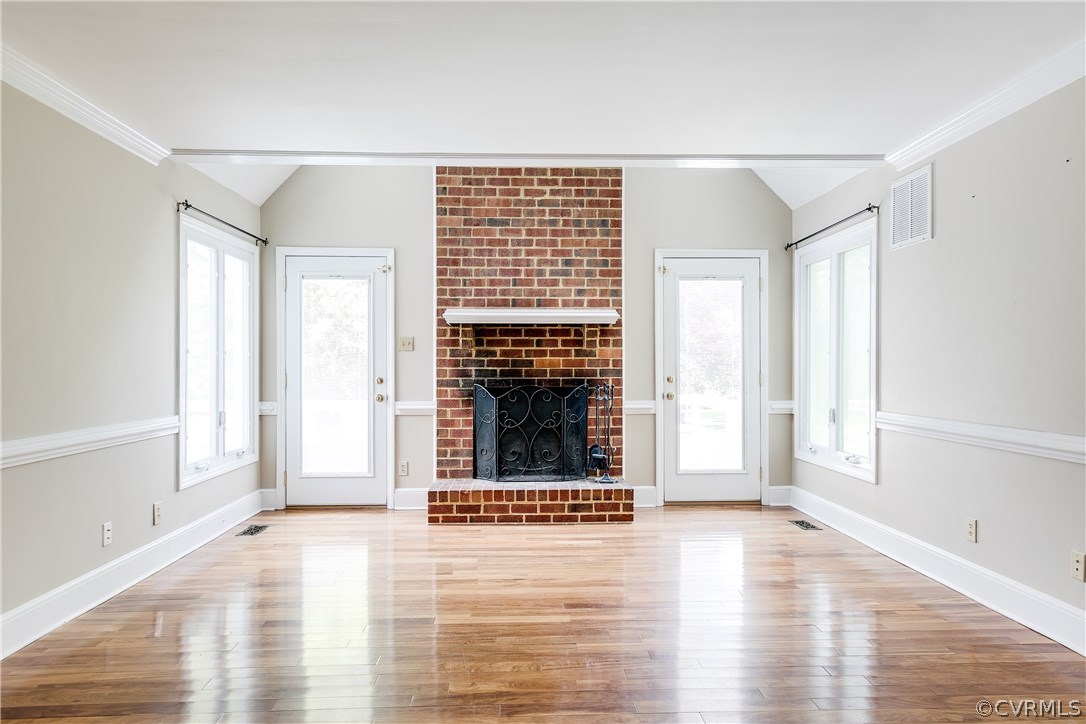 9641 Pasture Hill Road Midlothian, VA 23112 - Photo 15 of 30 a view of an empty room with glass door and wooden floor