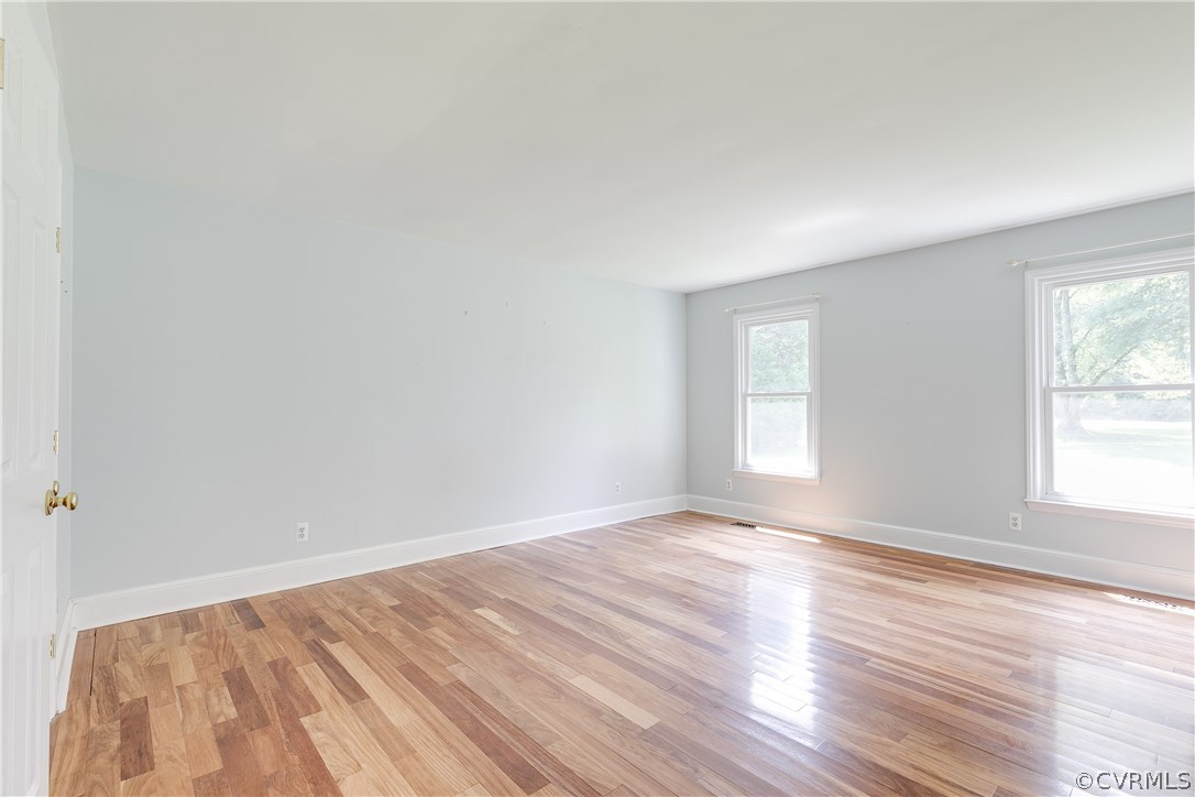 9641 Pasture Hill Road Midlothian, VA 23112 - Photo 16 of 30 an empty room with wooden floor and windows