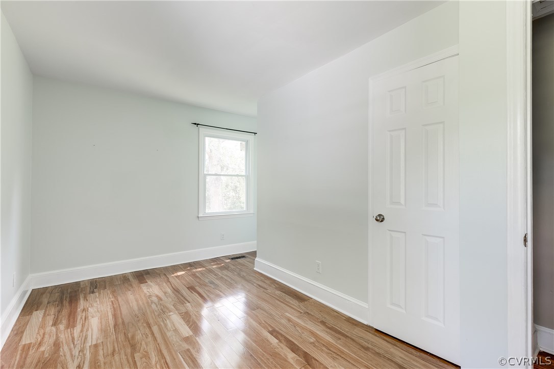 9641 Pasture Hill Road Midlothian, VA 23112 - Photo 20 of 30 an empty room with wooden floor and windows