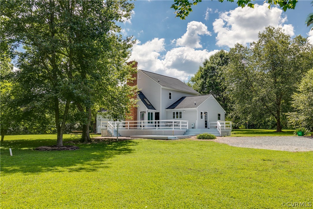 9641 Pasture Hill Road Midlothian, VA 23112 - Photo 6 of 30 a front view of a house with garden and trees