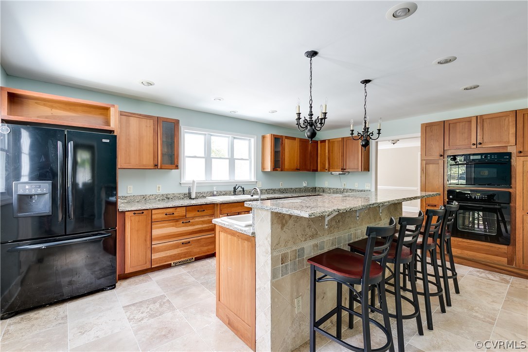 9641 Pasture Hill Road Midlothian, VA 23112 - Photo 10 of 30 a kitchen with stainless steel appliances granite countertop a stove top oven a refrigerator a sink and chairs