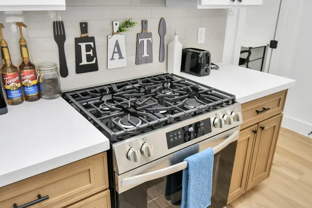 a bedroom with a bed and a washer