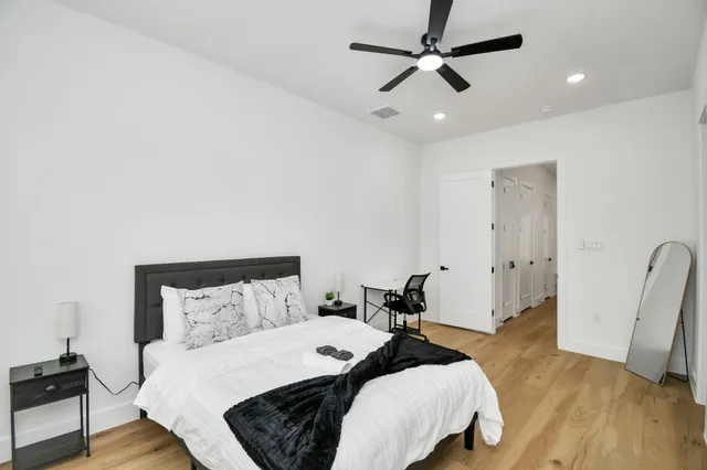 a view of a workspace with furniture and wooden floor