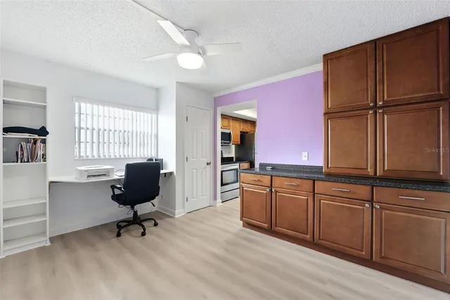 a kitchen with sink cabinets and wooden floor