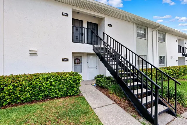 a view of a house with wooden stairs