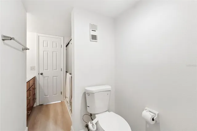 a white toilet sitting next to a bathroom sink