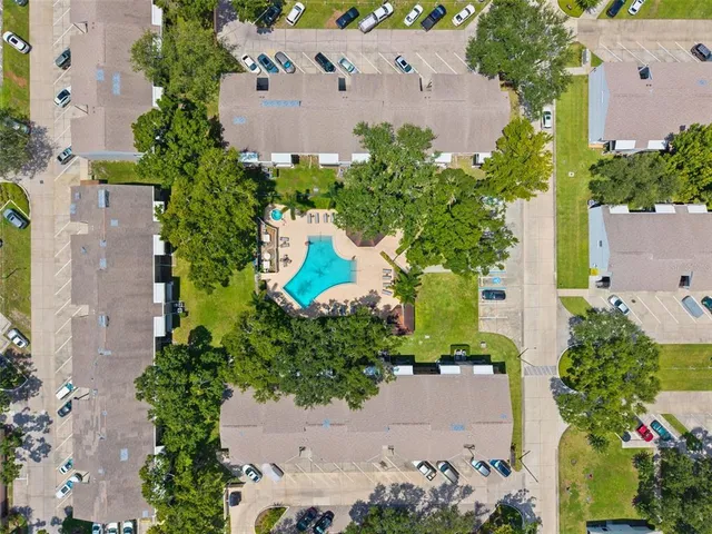 an aerial view of a house with a garden and yard