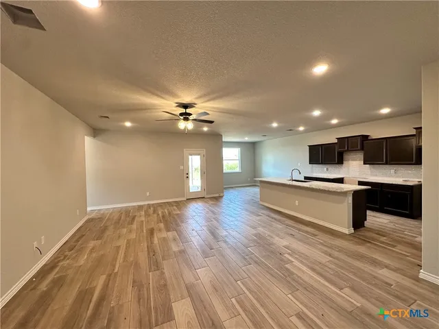 a view of kitchen with cabinets