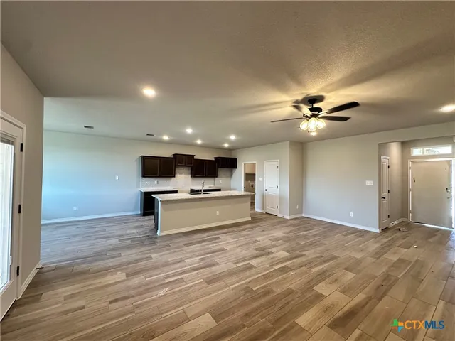 a view of a livingroom with kitchen