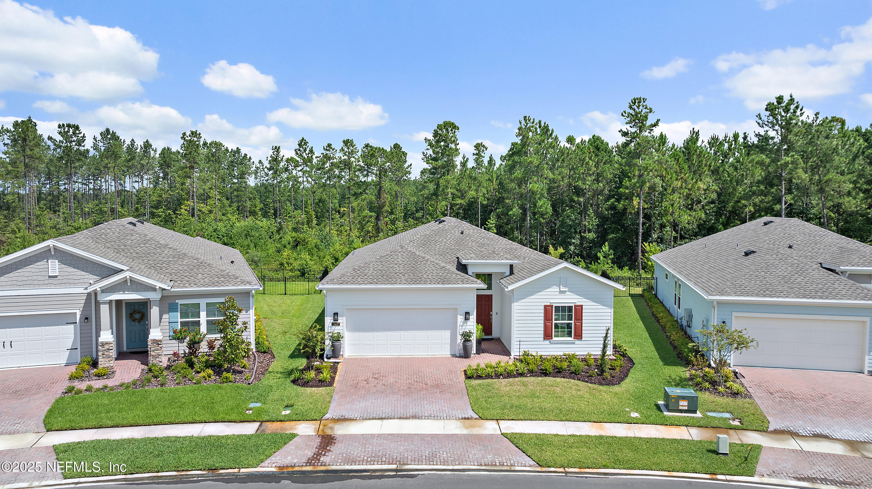 a front view of house with yard and green space