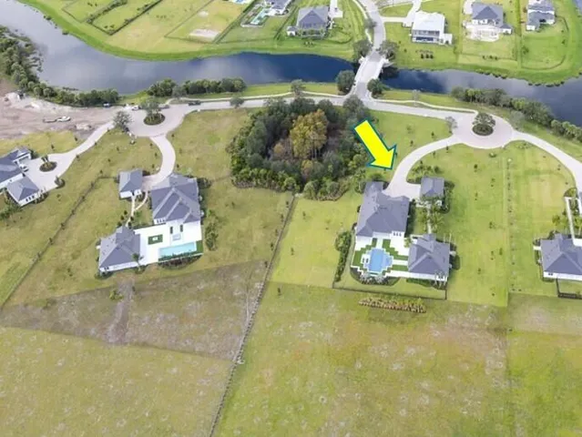 a front view of house with yard swimming pool and outdoor seating