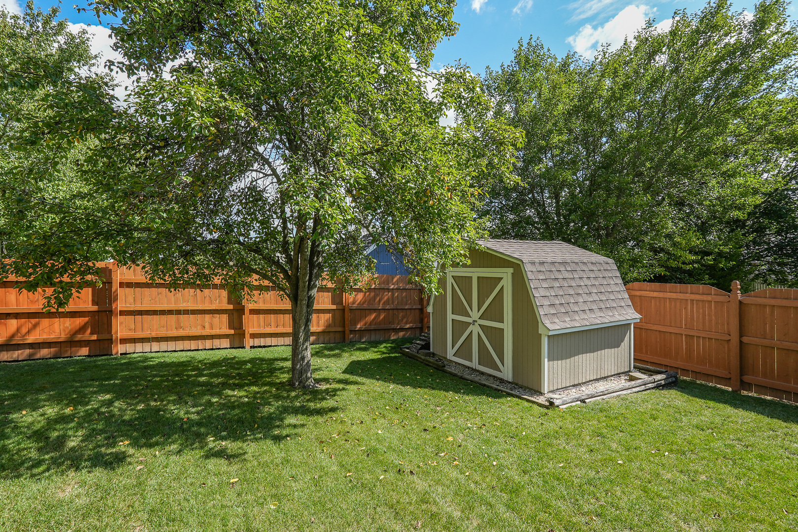 304 Andrea Drive Manhattan, IL 60442 - Photo 14 of 53 a view of a small house in the forest