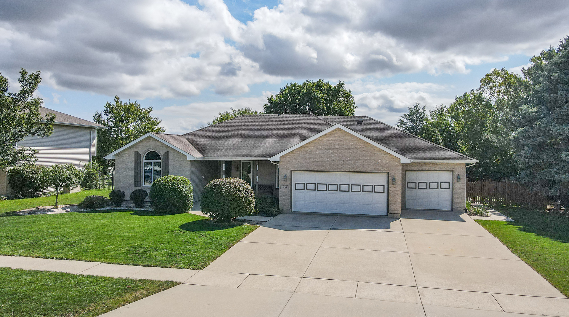 304 Andrea Drive Manhattan, IL 60442 - Photo 2 of 53 a view of a house with a small yard and a large tree