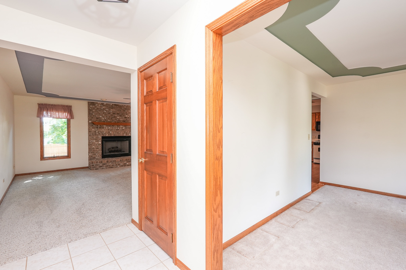 304 Andrea Drive Manhattan, IL 60442 - Photo 22 of 53 a view of an entryway with wooden floor and a kitchen