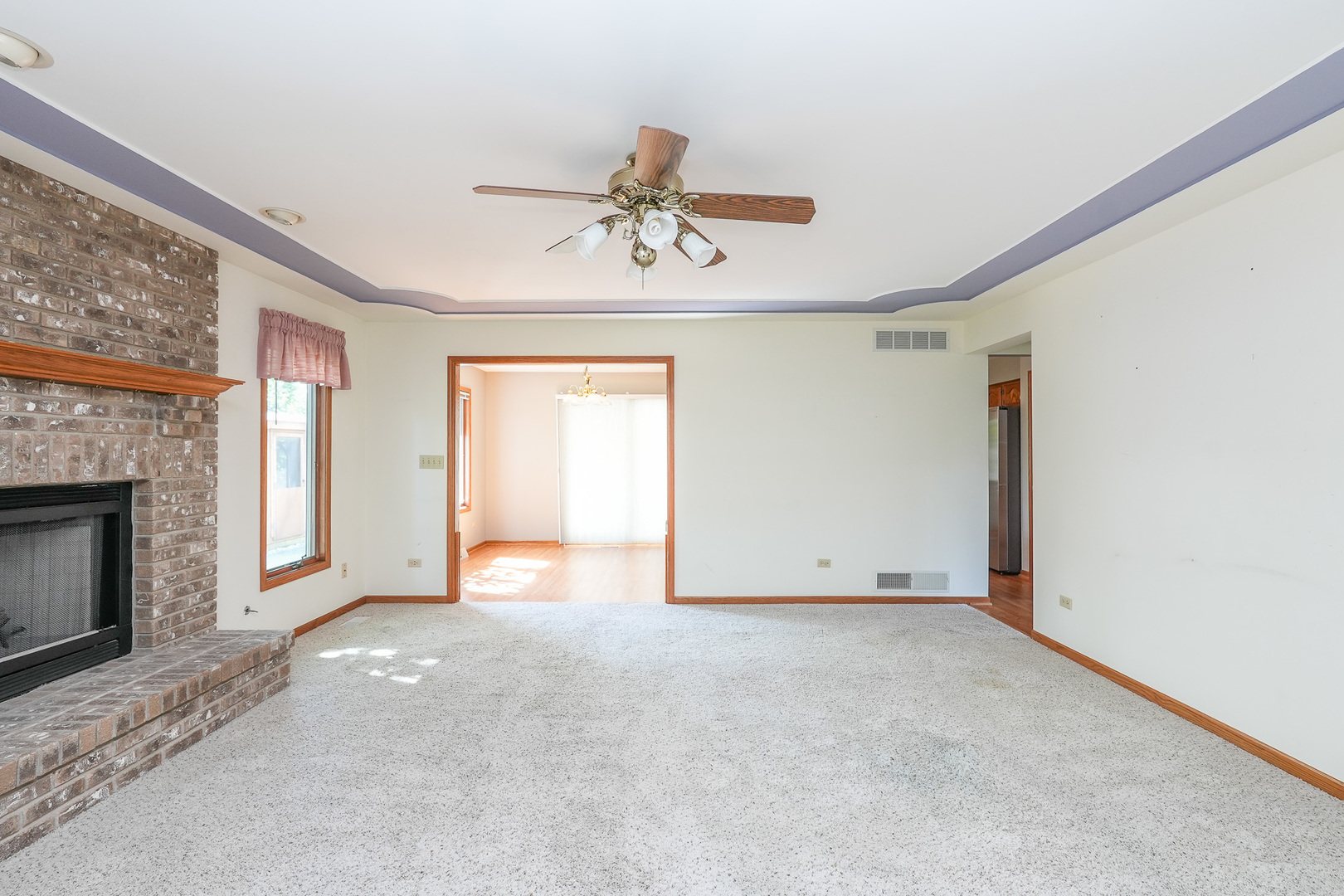 304 Andrea Drive Manhattan, IL 60442 - Photo 25 of 53 a view of an empty room with a fireplace and a window