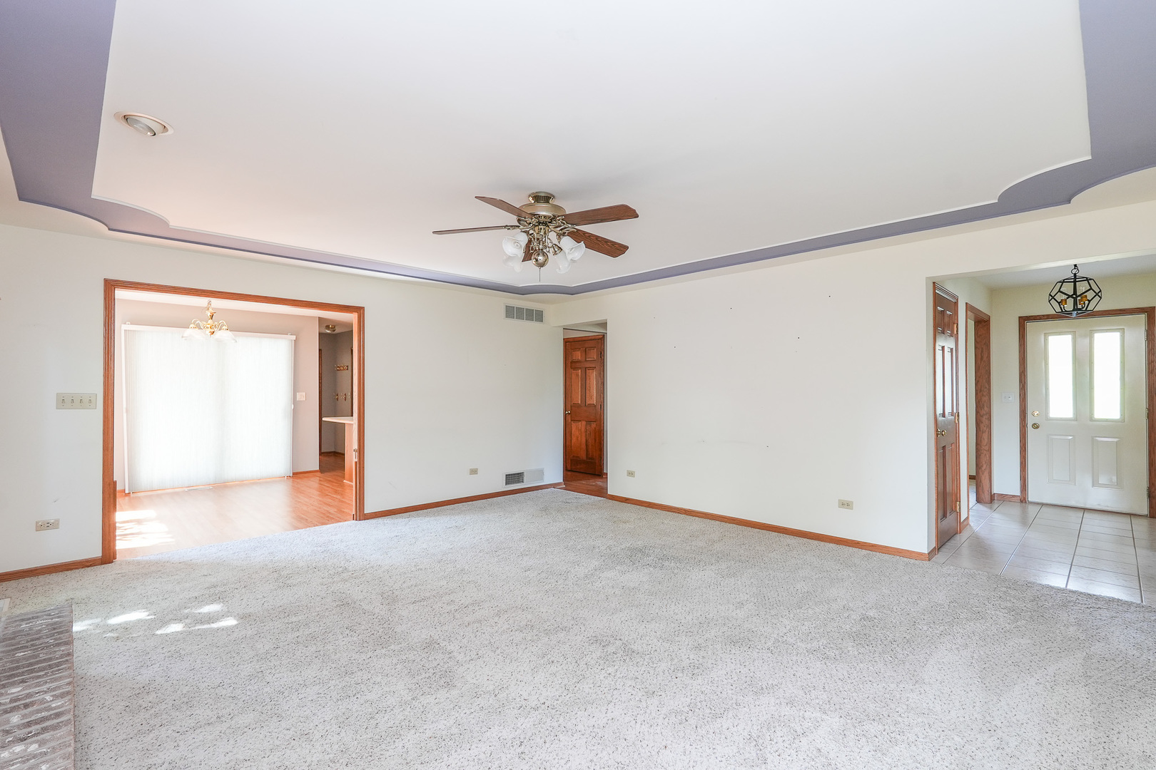 304 Andrea Drive Manhattan, IL 60442 - Photo 26 of 53 an empty room with ceiling fan and windows