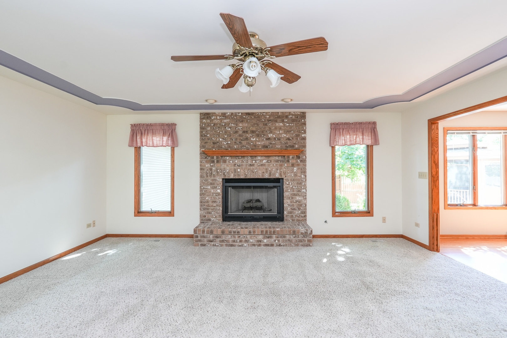 304 Andrea Drive Manhattan, IL 60442 - Photo 29 of 53 a view of an empty room with a fireplace and a window