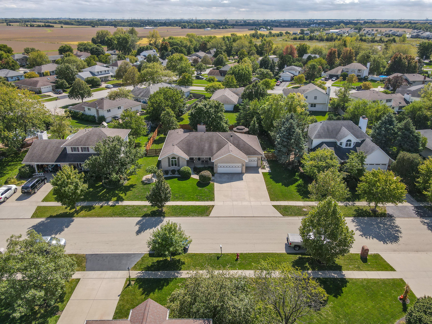 304 Andrea Drive Manhattan, IL 60442 - Photo 4 of 53 an aerial view of a house with a yard and lake view