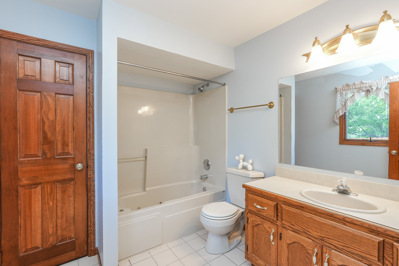 304 Andrea Drive Manhattan, IL 60442 - Photo 44 of 53 a bathroom with a sink a toilet and shower
