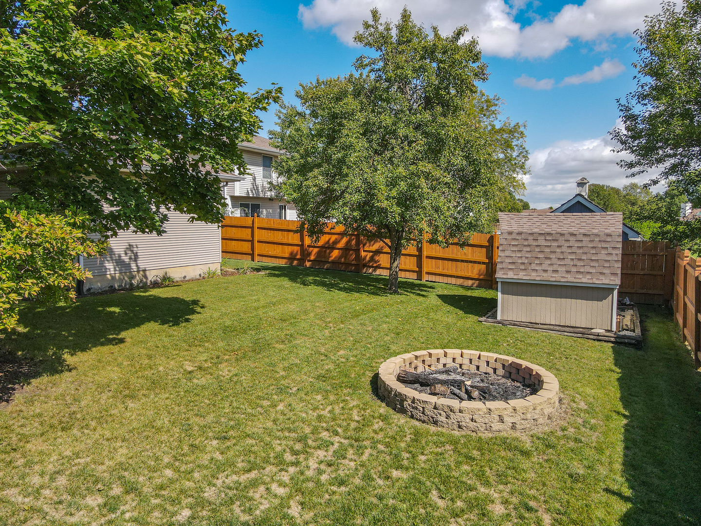304 Andrea Drive Manhattan, IL 60442 - Photo 8 of 53 a view of a backyard with a garden