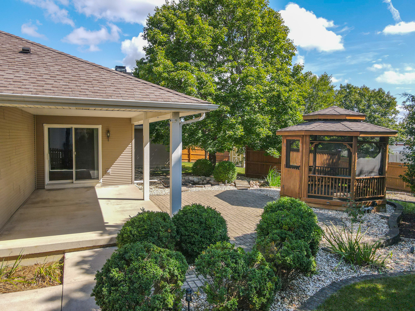 304 Andrea Drive Manhattan, IL 60442 - Photo 10 of 53 a front view of a house with garden