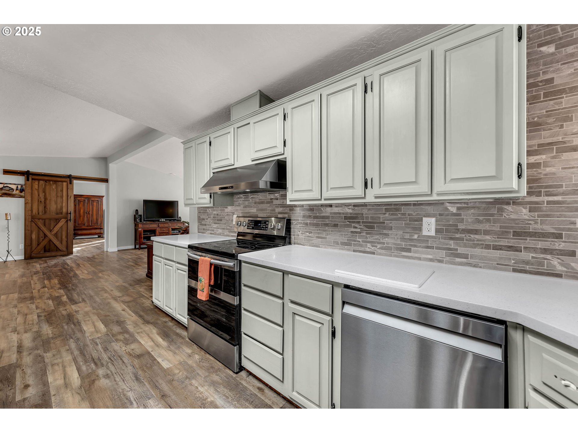 111 Mathany Road Carson, WA 98610 - Photo 12 of 39 a kitchen with stainless steel appliances granite countertop a stove a sink and a microwave