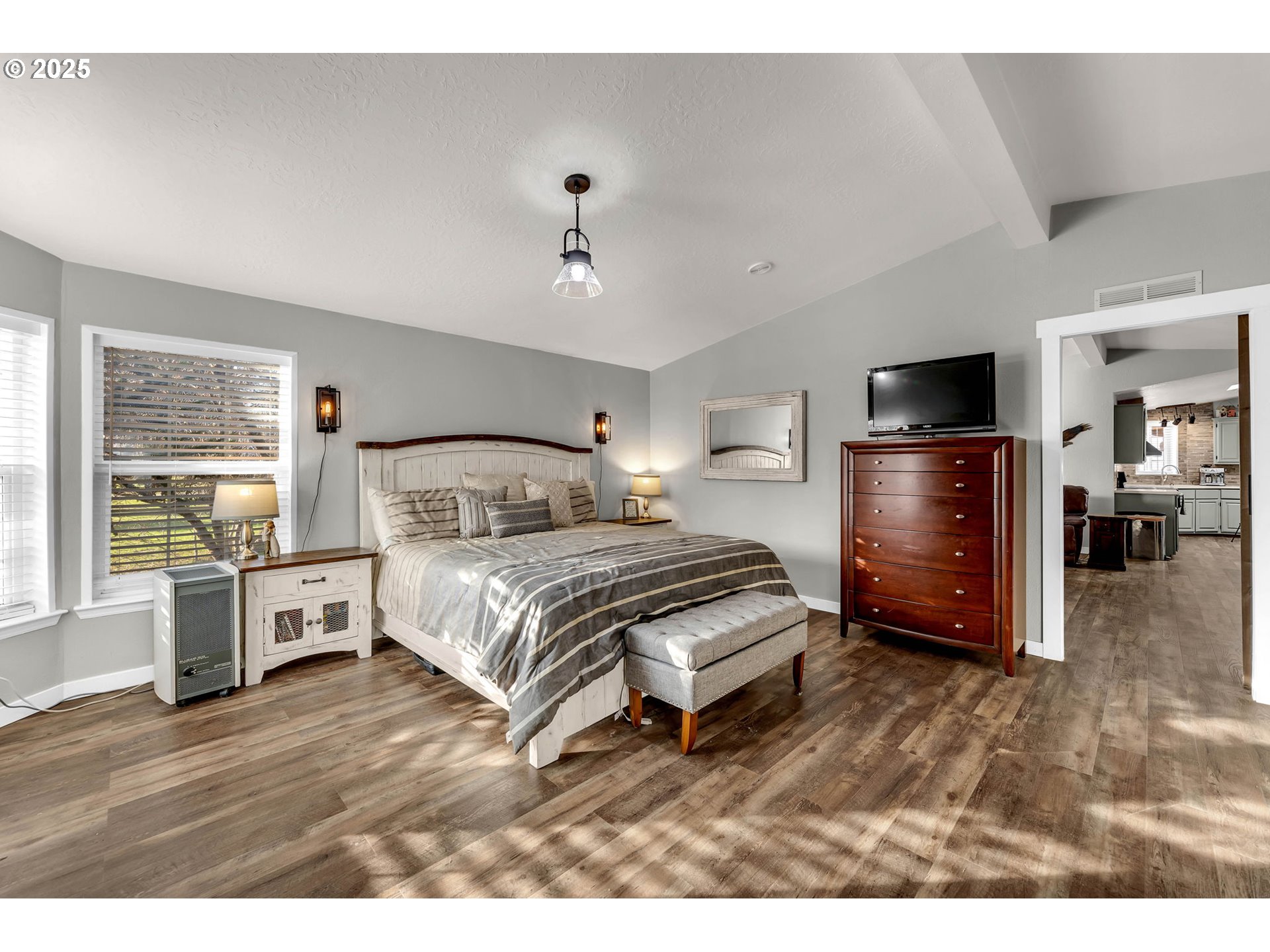 111 Mathany Road Carson, WA 98610 - Photo 25 of 39 a bedroom with a bed and wooden floor