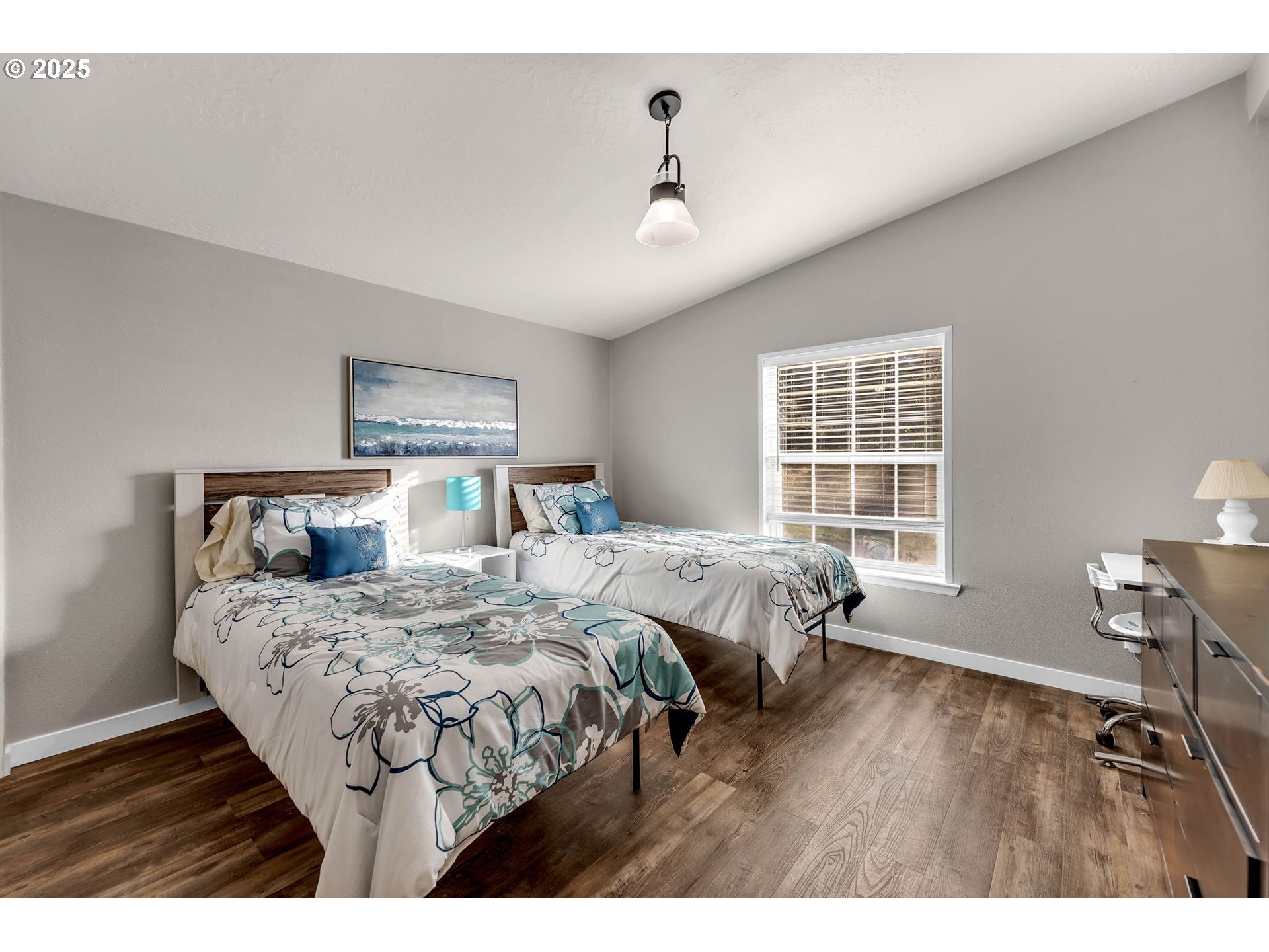 111 Mathany Road Carson, WA 98610 - Photo 32 of 39 a bedroom with two beds and a large window