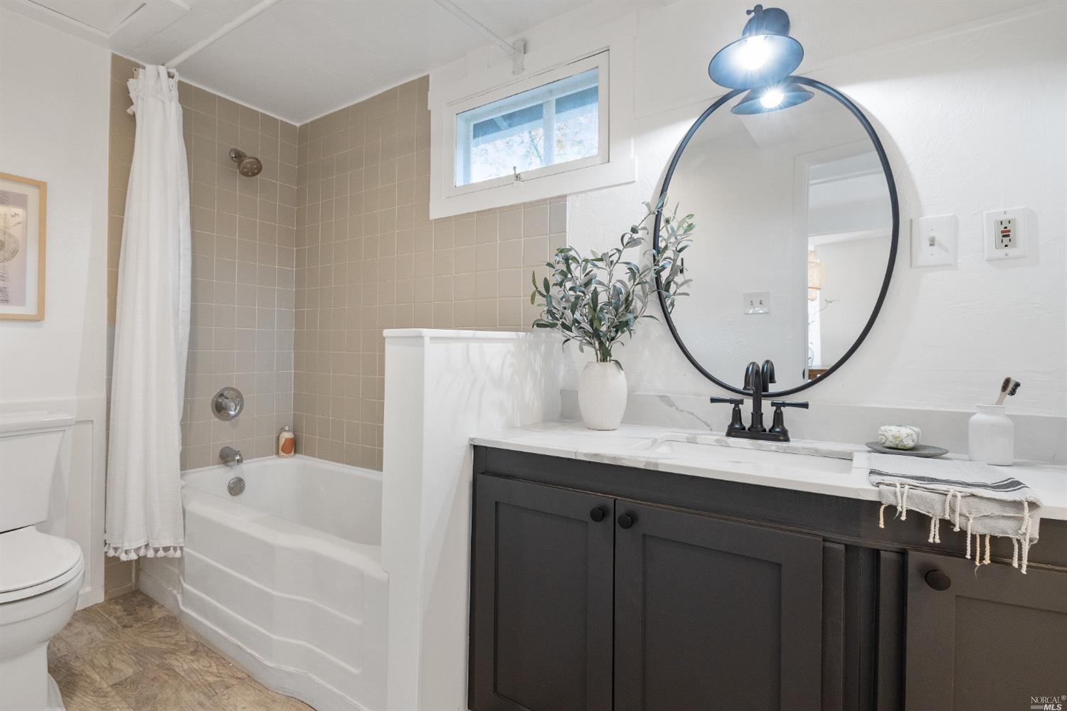 27 Laurel Avenue San Anselmo, CA 94960 - Photo 18 of 52 a bathroom with a sink a toilet and a mirror