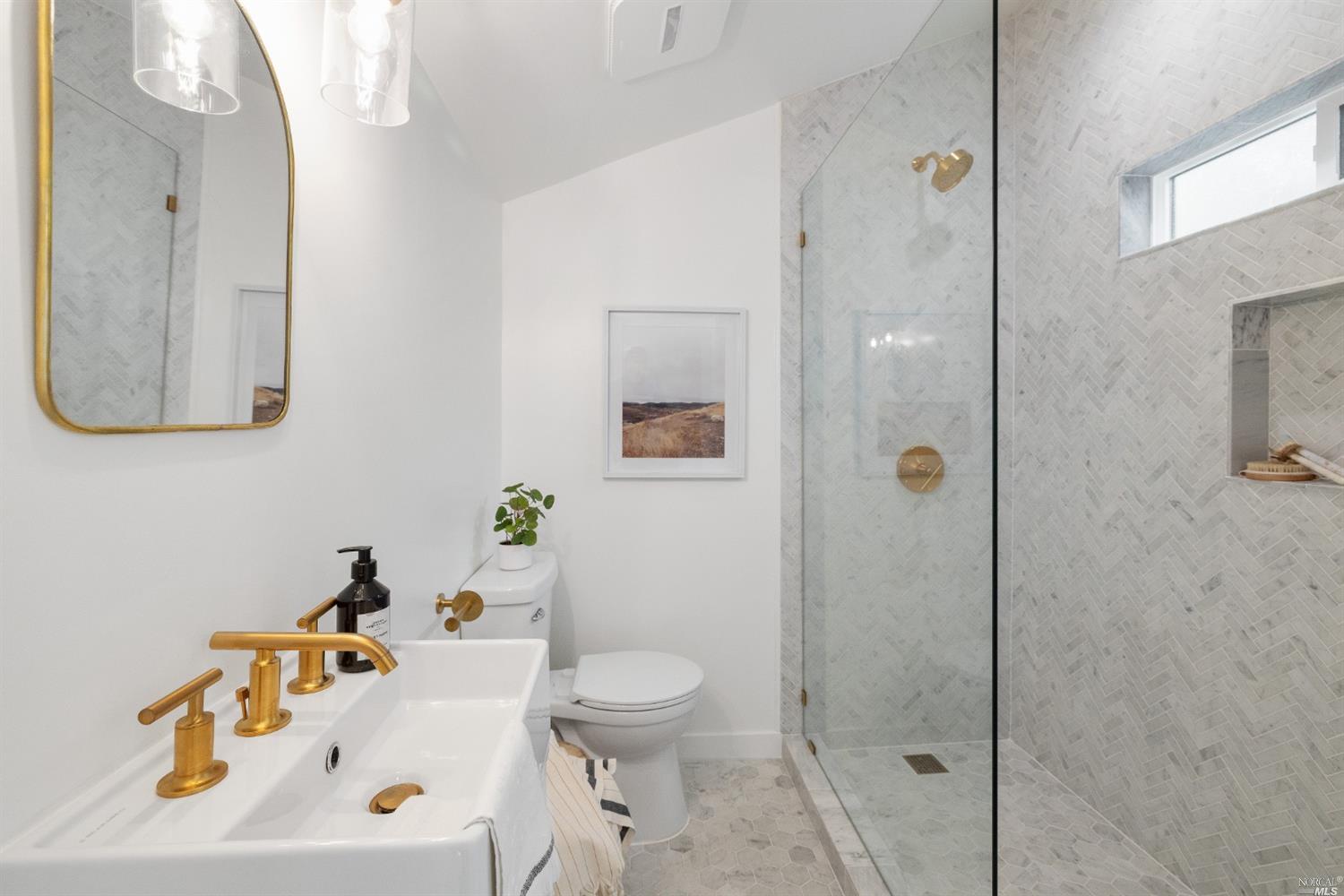 27 Laurel Avenue San Anselmo, CA 94960 - Photo 28 of 52 a bathroom with a sink a toilet and shower