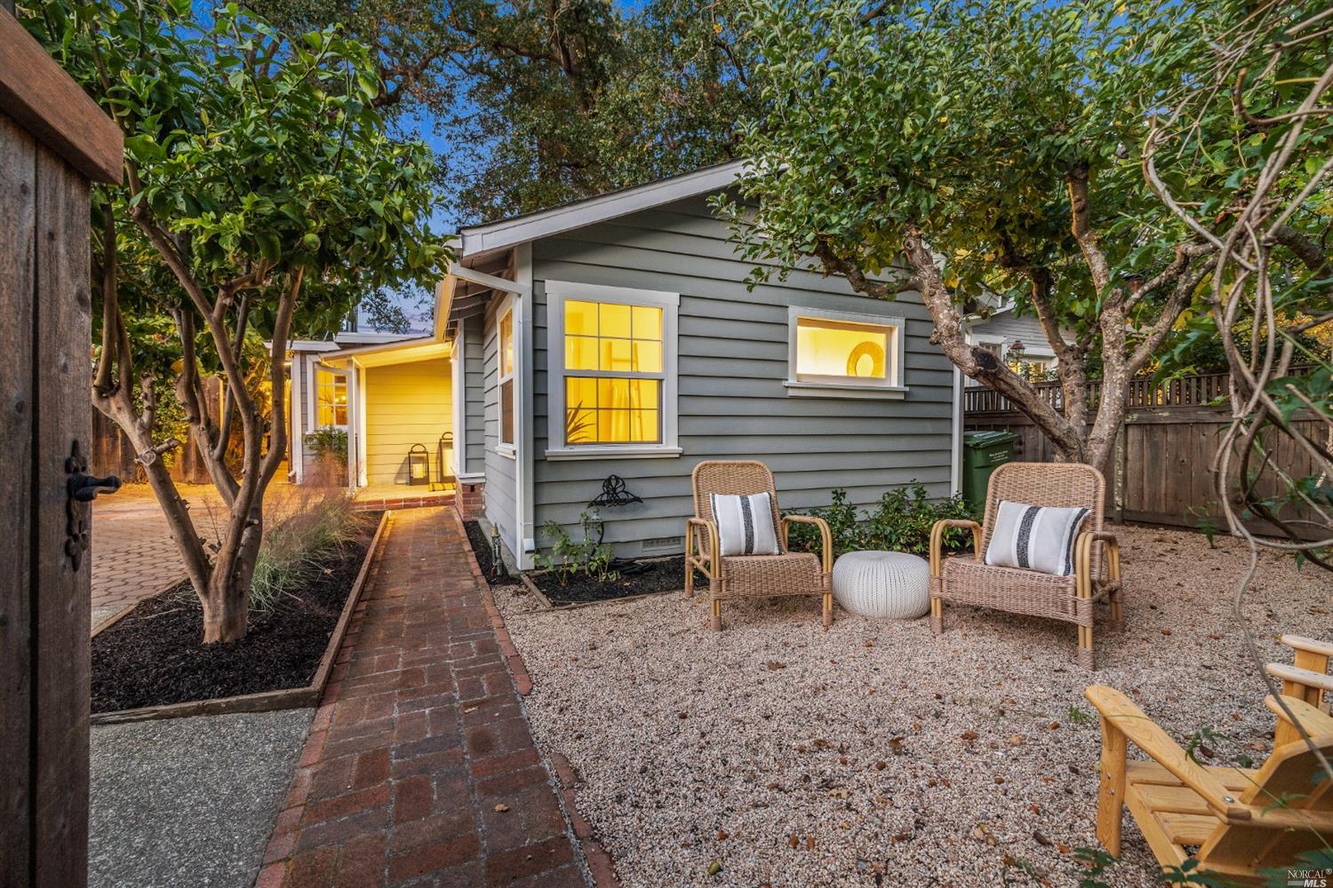 27 Laurel Avenue San Anselmo, CA 94960 - Photo 47 of 52 a view of a patio with couches table and chairs under an umbrella
