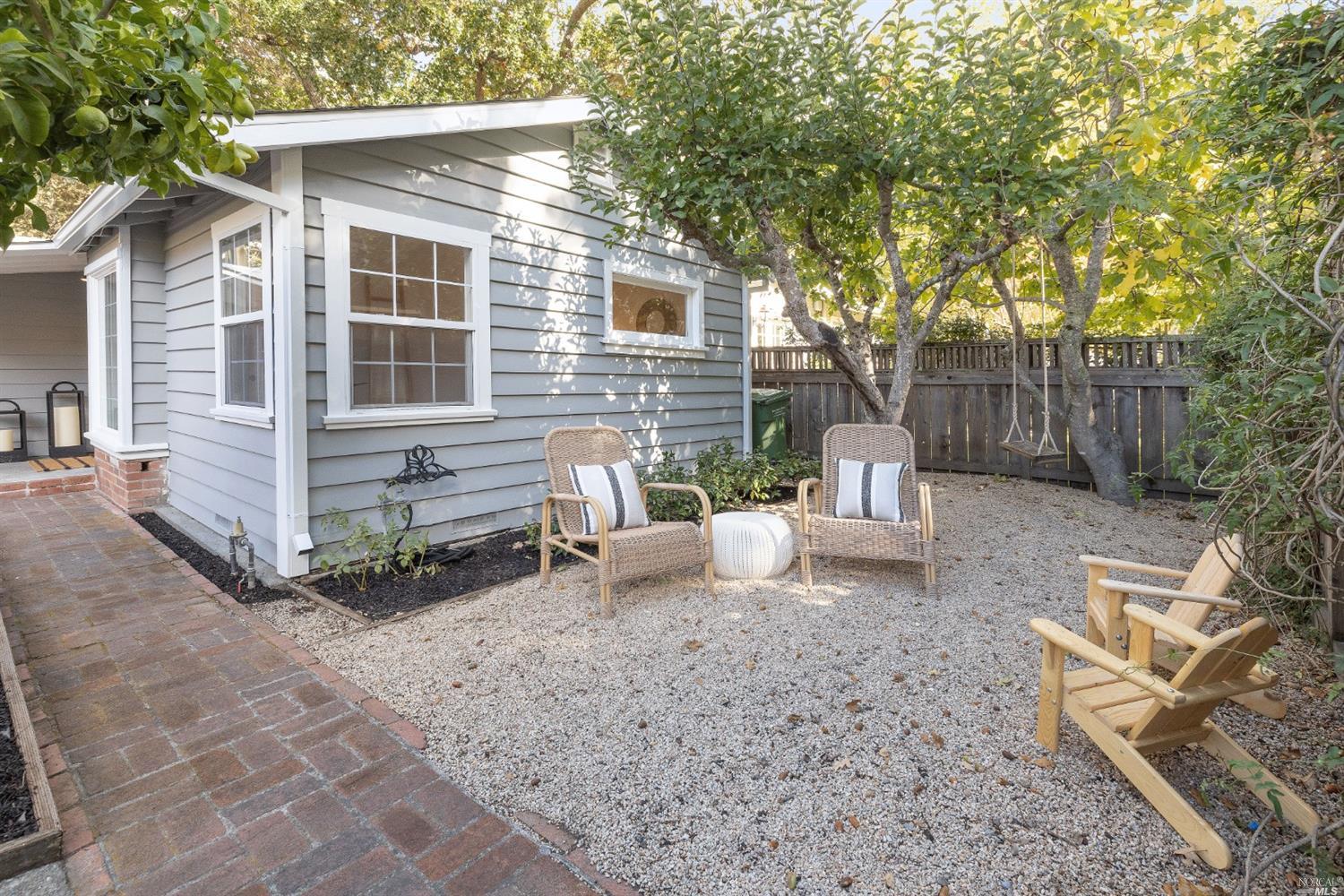 27 Laurel Avenue San Anselmo, CA 94960 - Photo 51 of 52 a view of a patio with a table and chairs next to a yard