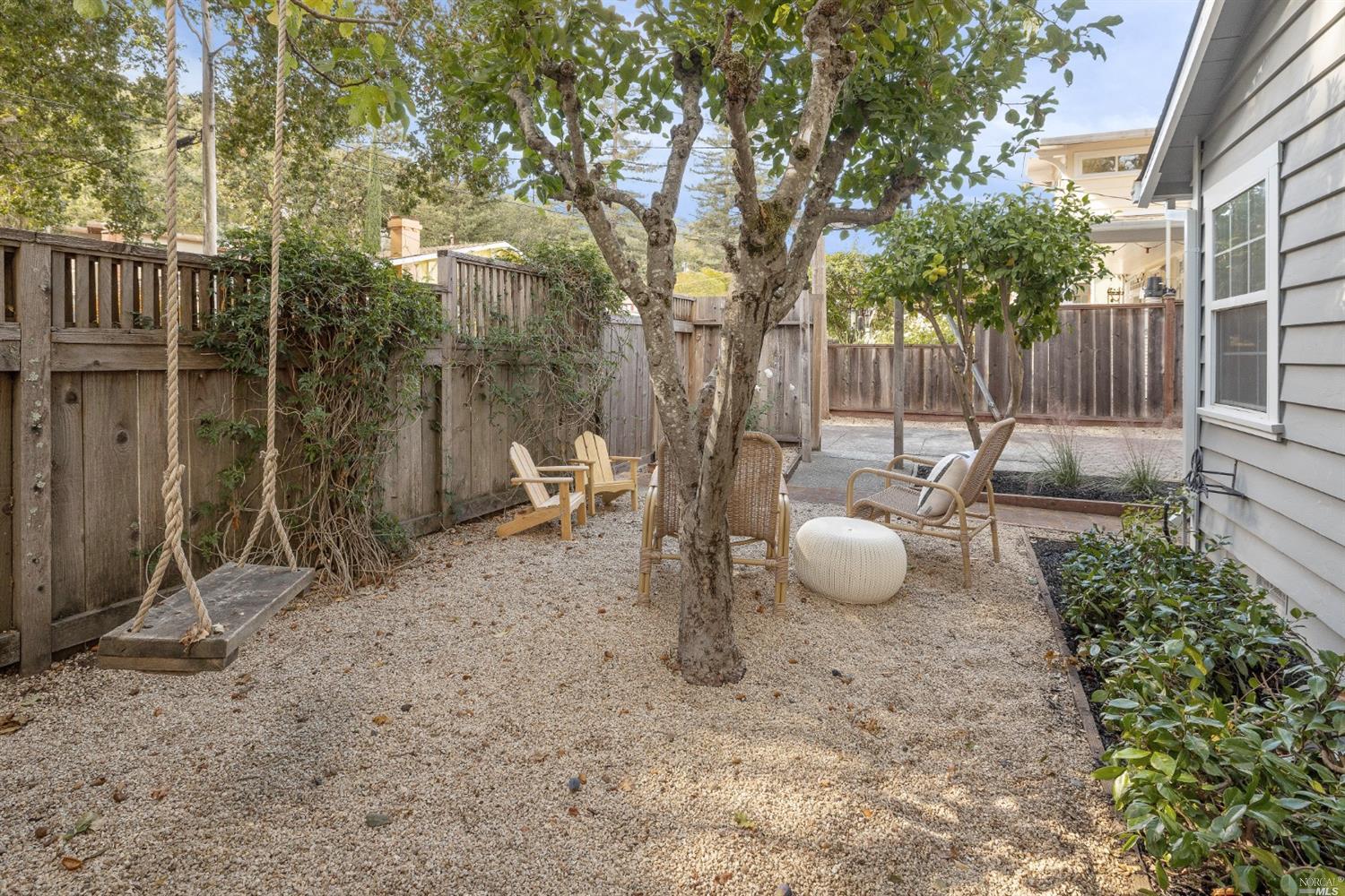 27 Laurel Avenue San Anselmo, CA 94960 - Photo 52 of 52 a backyard of a house with table and chairs