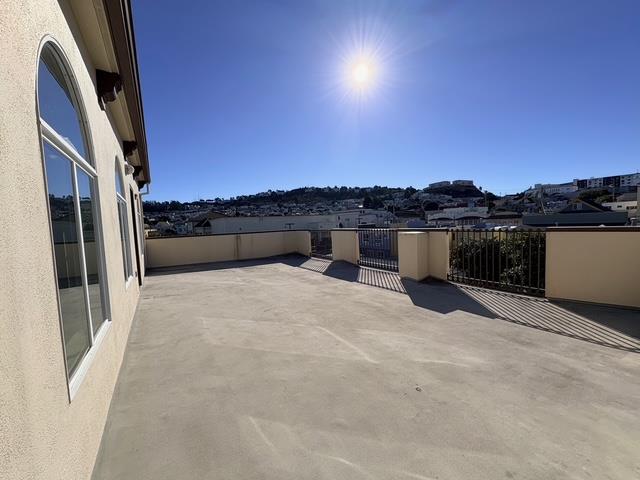 89 Goethe Street, Unit 3 Daly City, CA 94014 - Photo 1 of 10 a view of a terrace with a bench
