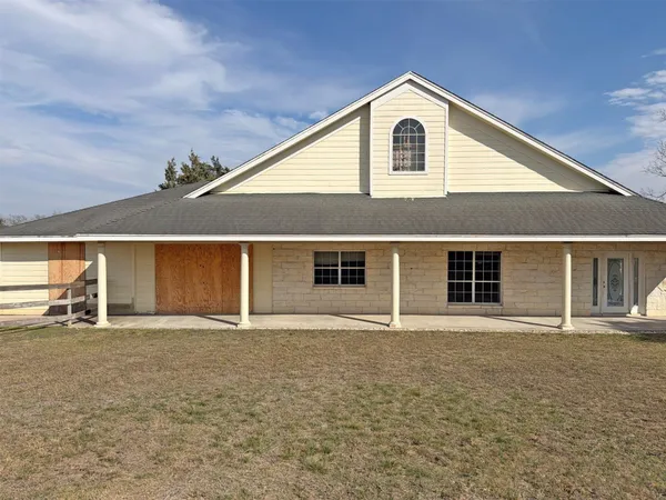 a front view of a house with yard