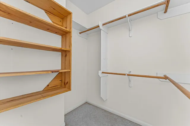 a view of an empty walk in closet