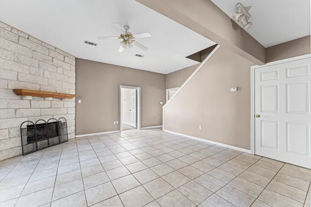 a view of an empty room with a fireplace