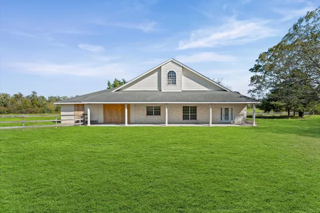 a front of a house with a garden
